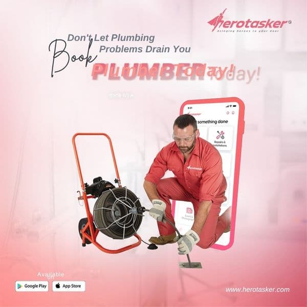 Plumber inspecting pipework under a basin